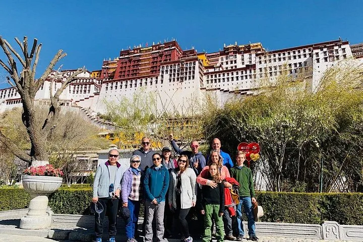 Tour group in front of the Potala Palace in Lhasa at the start of an Everest climbing tour to Everest Base Camp in Tibet