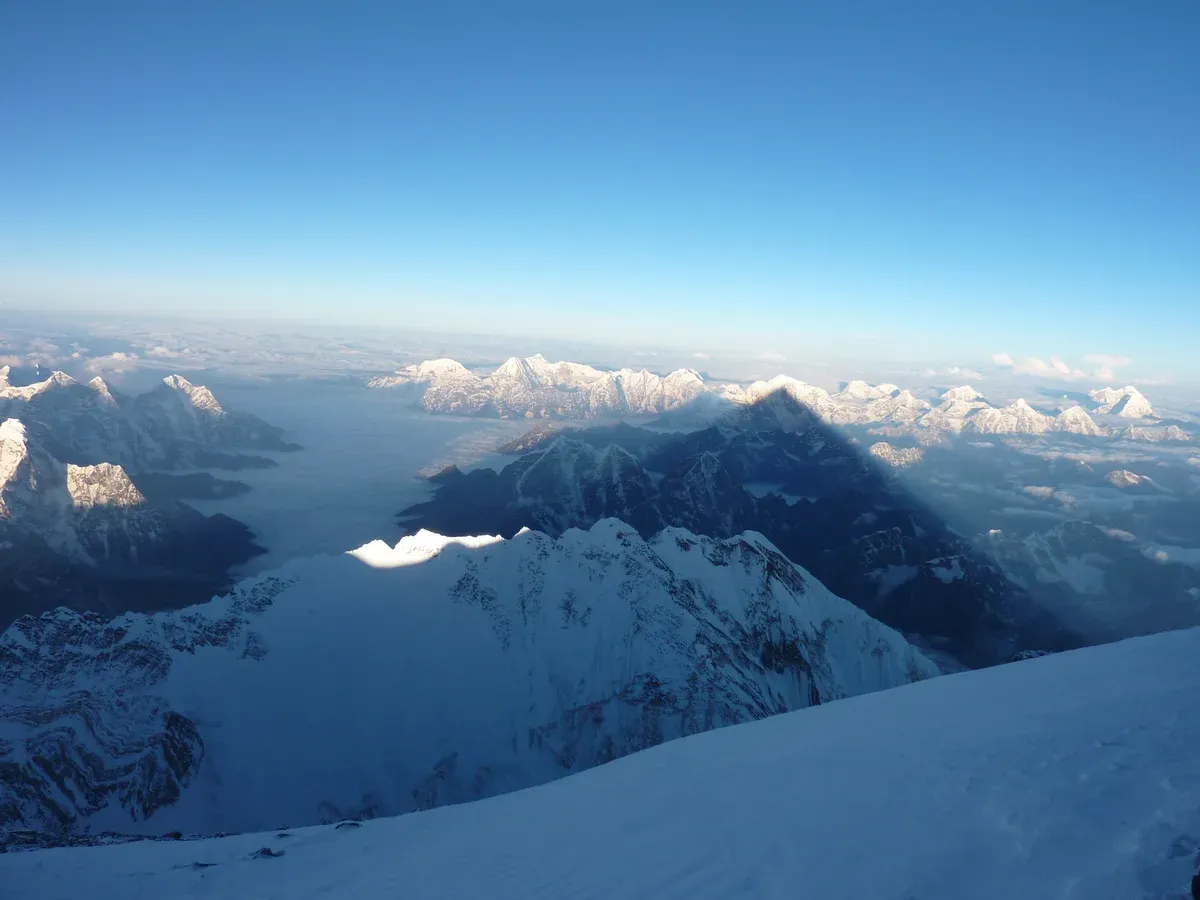 Sunrise from the summit of Mount Everest over Nuptse on Everest climbing tours, Nepal